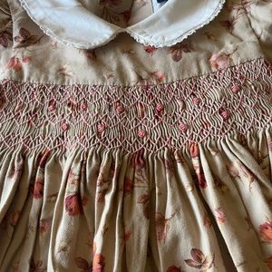 Beautiful girl 12 month smoked dress. Long sleeve, covered buttons, white collar